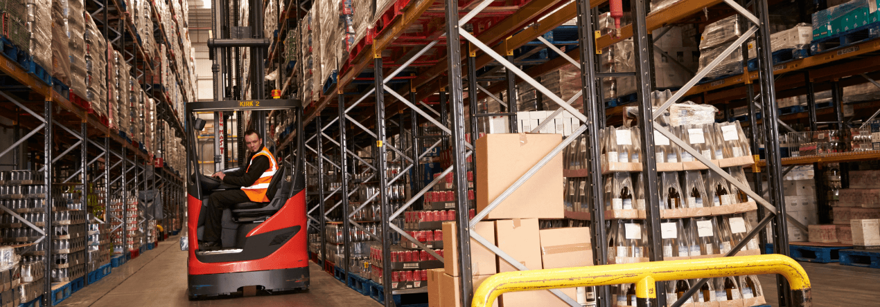 worker using a reach truck in an e-commerce fulfilment centre