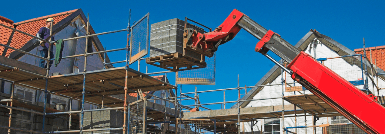 Telescopic forklift being used on a construction site